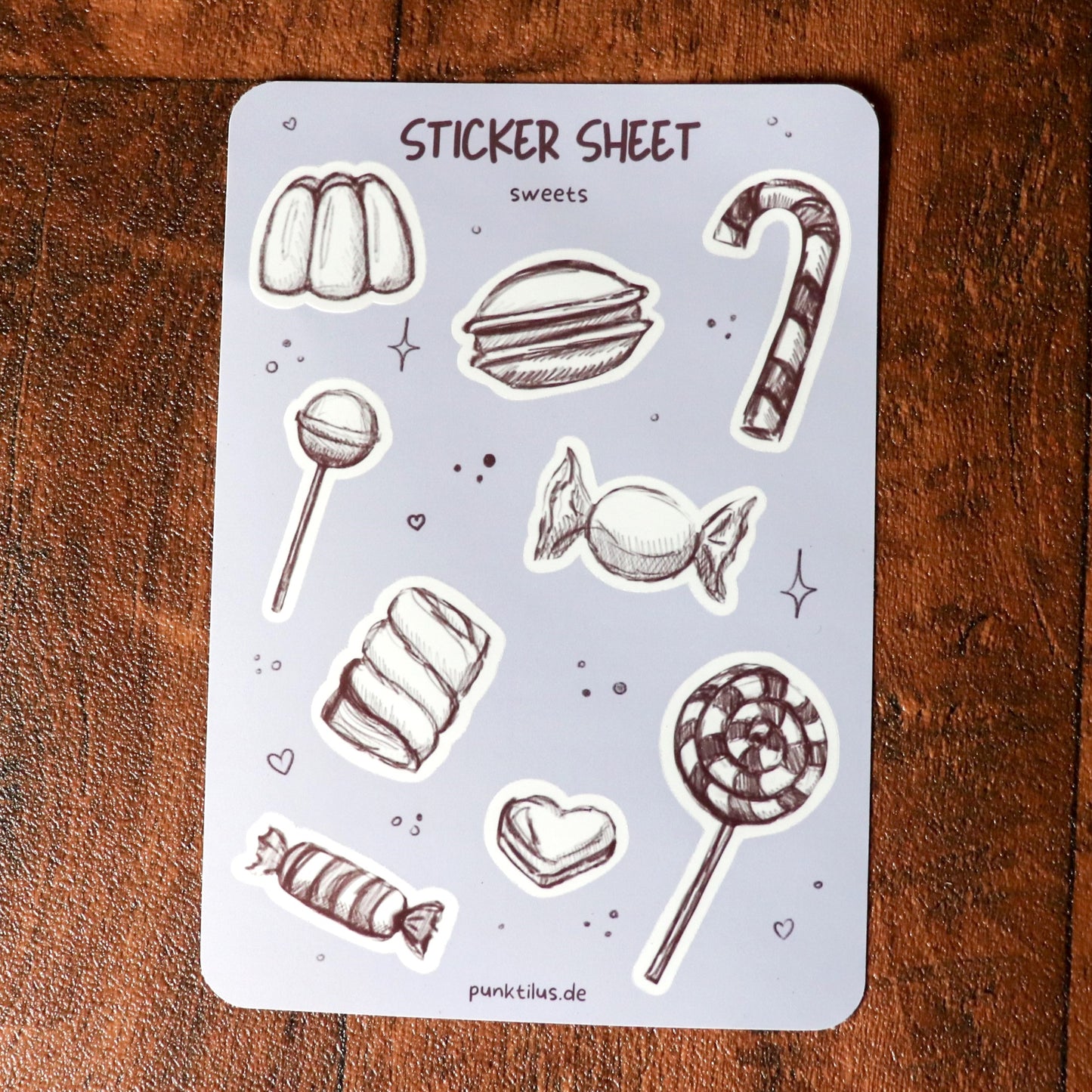Detailaufnahme der glänzenden Bonbon-Sticker im Skizzen-Stil.
